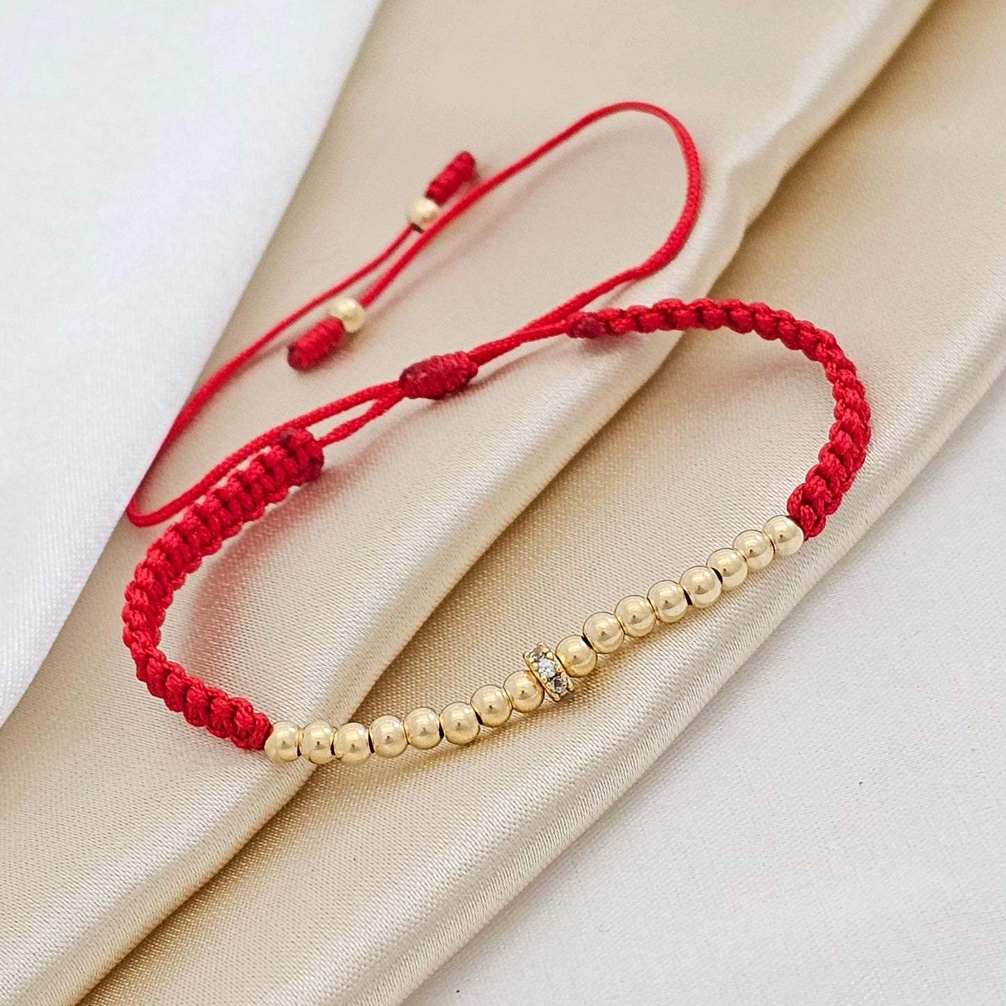 MJ PULSERA MACRAME GOLD#3 Y CIRCONIA ROJA