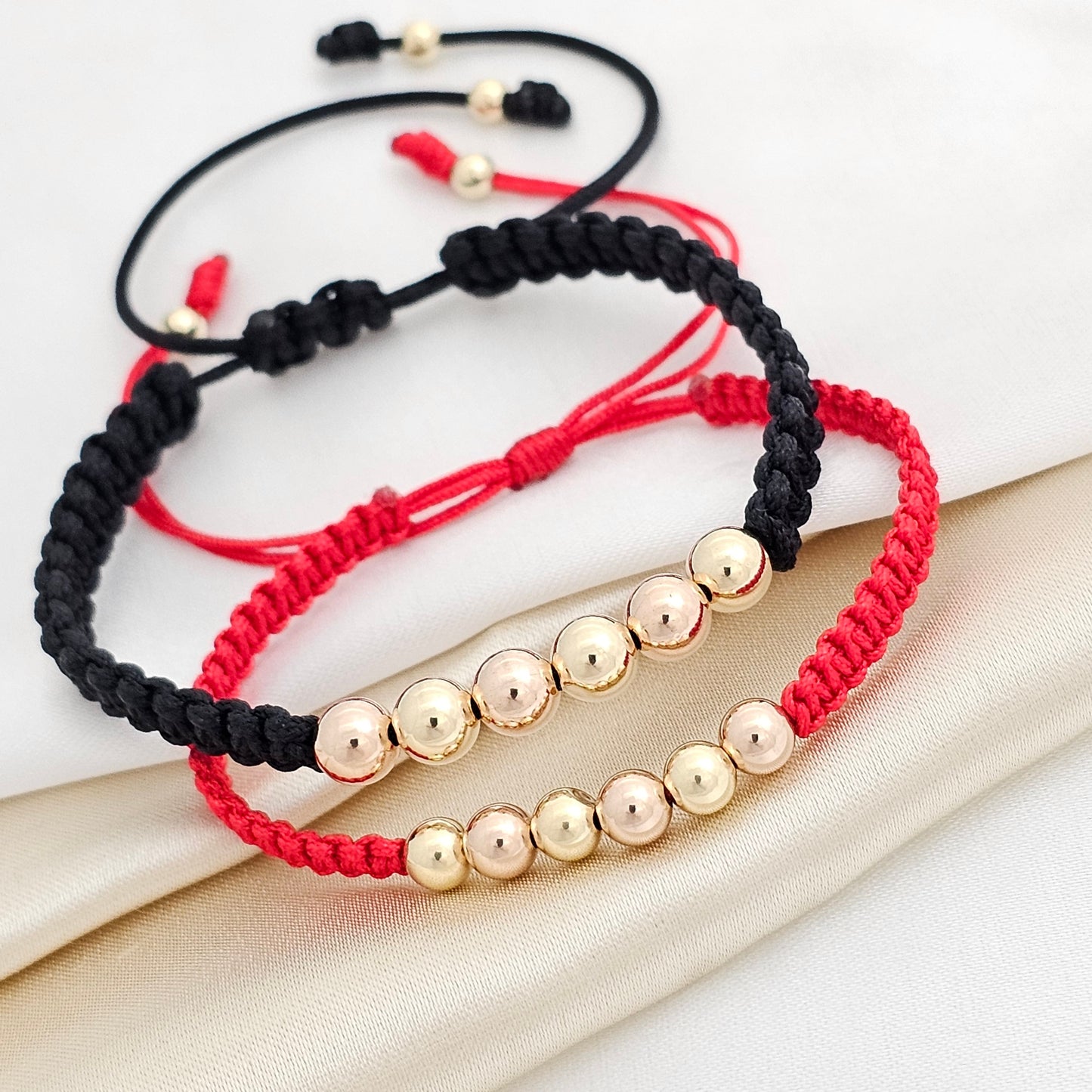 MJ PULSERA GOLD DUO MACRAME BALIN ROSA Y DORA ROJA Y NEGRA