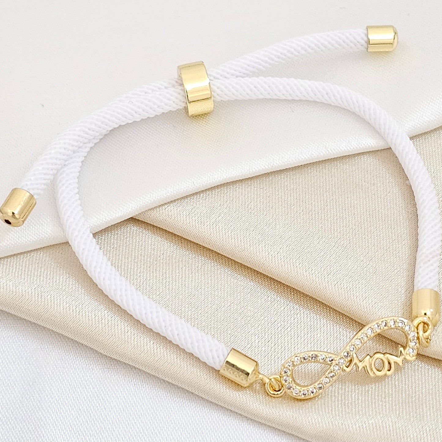 PULSERA BLANC AJUSTABLE C / HERRAJE INFINITO DORAD