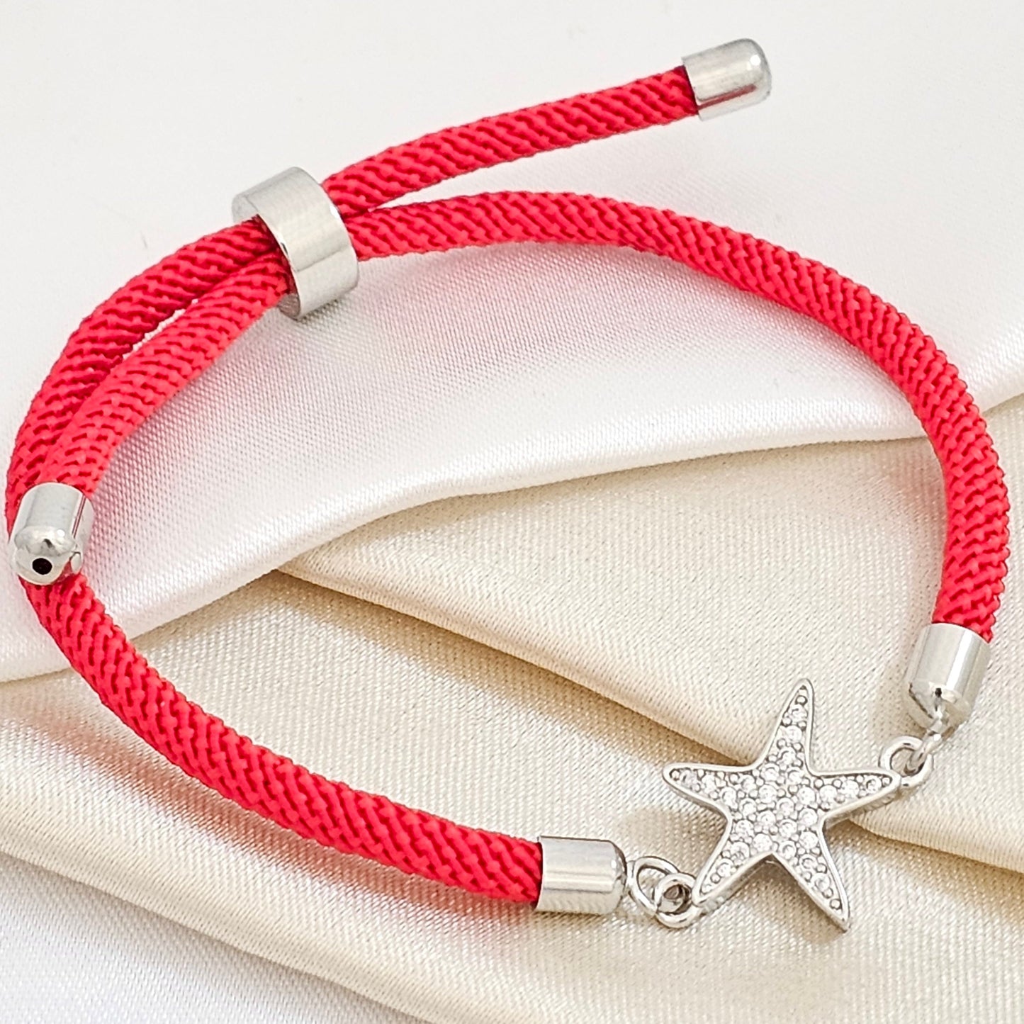 PULSERA ROJA AJUSTABL C / HERRAJE ESTRELLA DE M PLATE