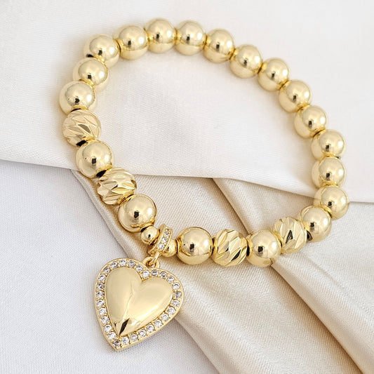 PULSERA FLEXIBLE BALINES CON DIJE CORAZON DORADO RF K4687