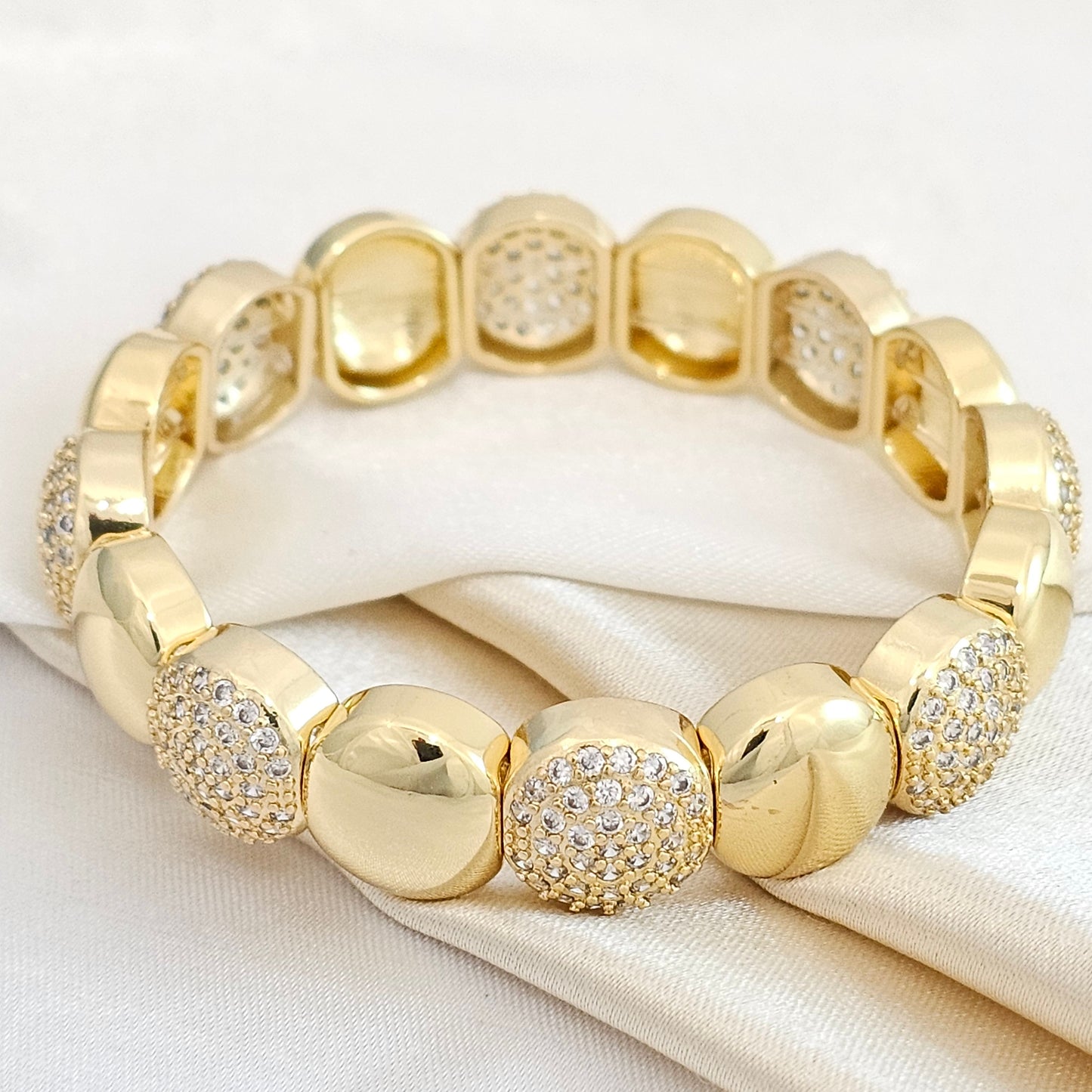 PULSERA FLEXIBLE CIRCULOS LISOS Y CIRCONES DORADO RF K4874