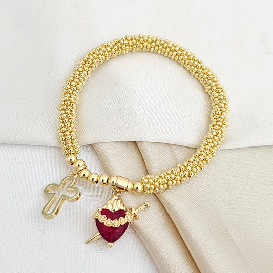 PULSERA FLEXIBLE DORADO DIJE CRUZ Y CORAZON CON ESPADA ROJO RF K5298