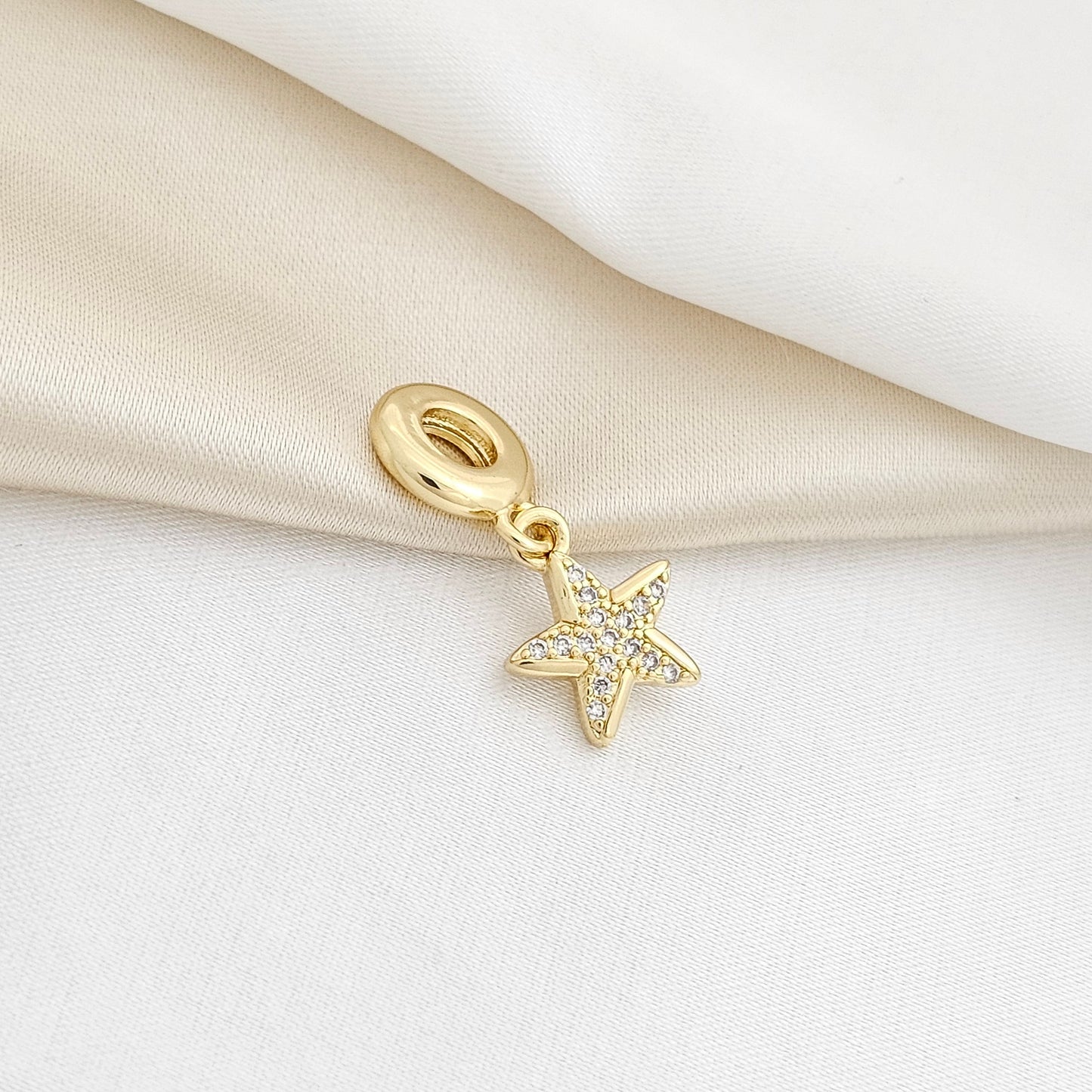 CHARM ESTRELLA DE MAR CIRCONES DORADO RF K3948