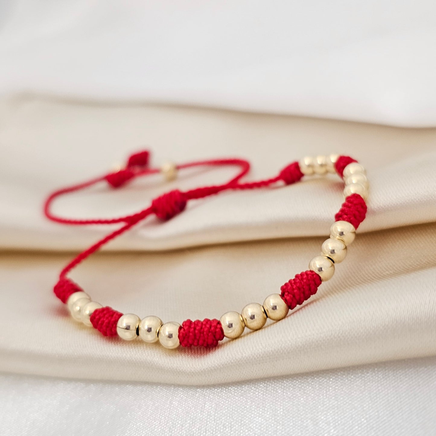 PULSERA GOLD C/ NUDOS #4 ROJA