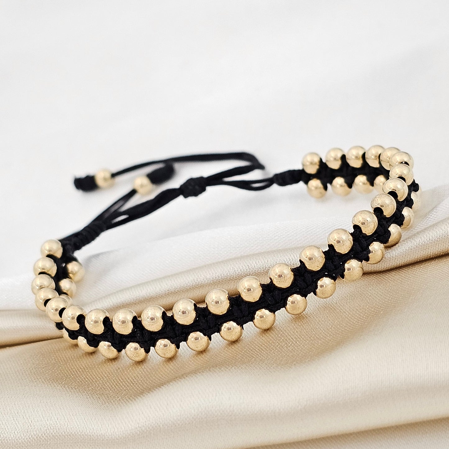 PULSERA LATERAL GOLD #4 NEGRA